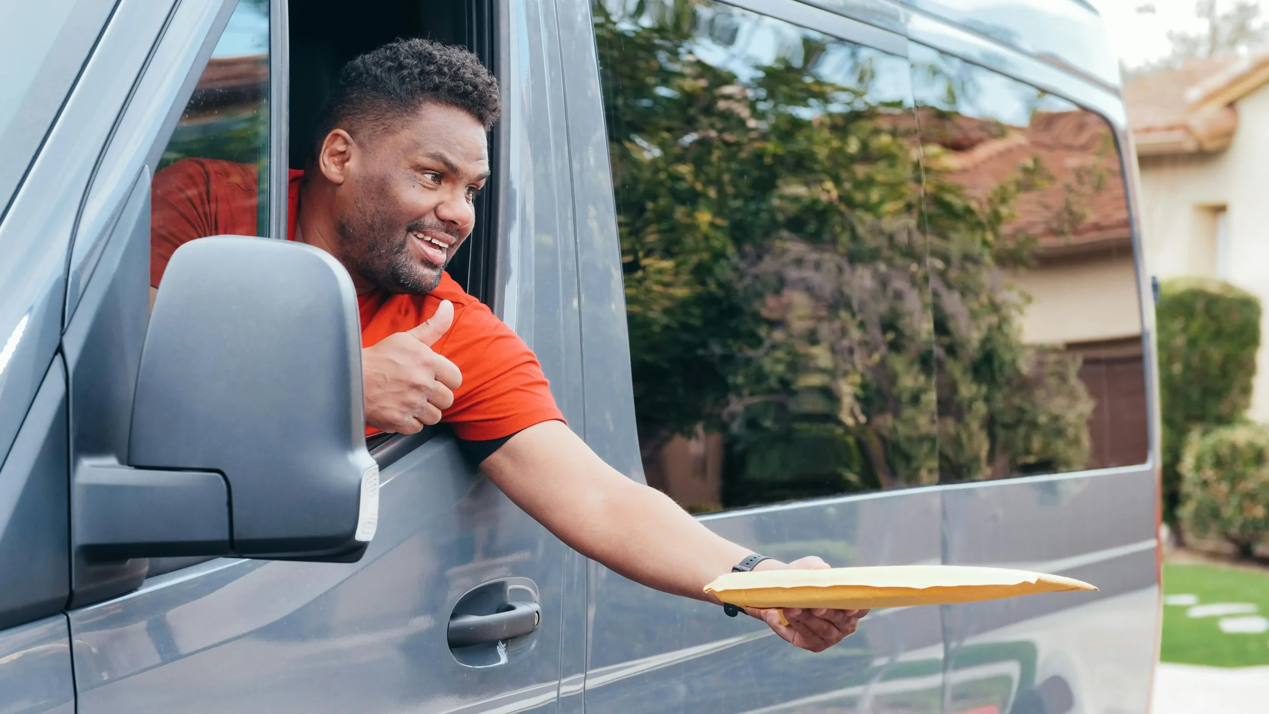 Delivery driver handing over packages.